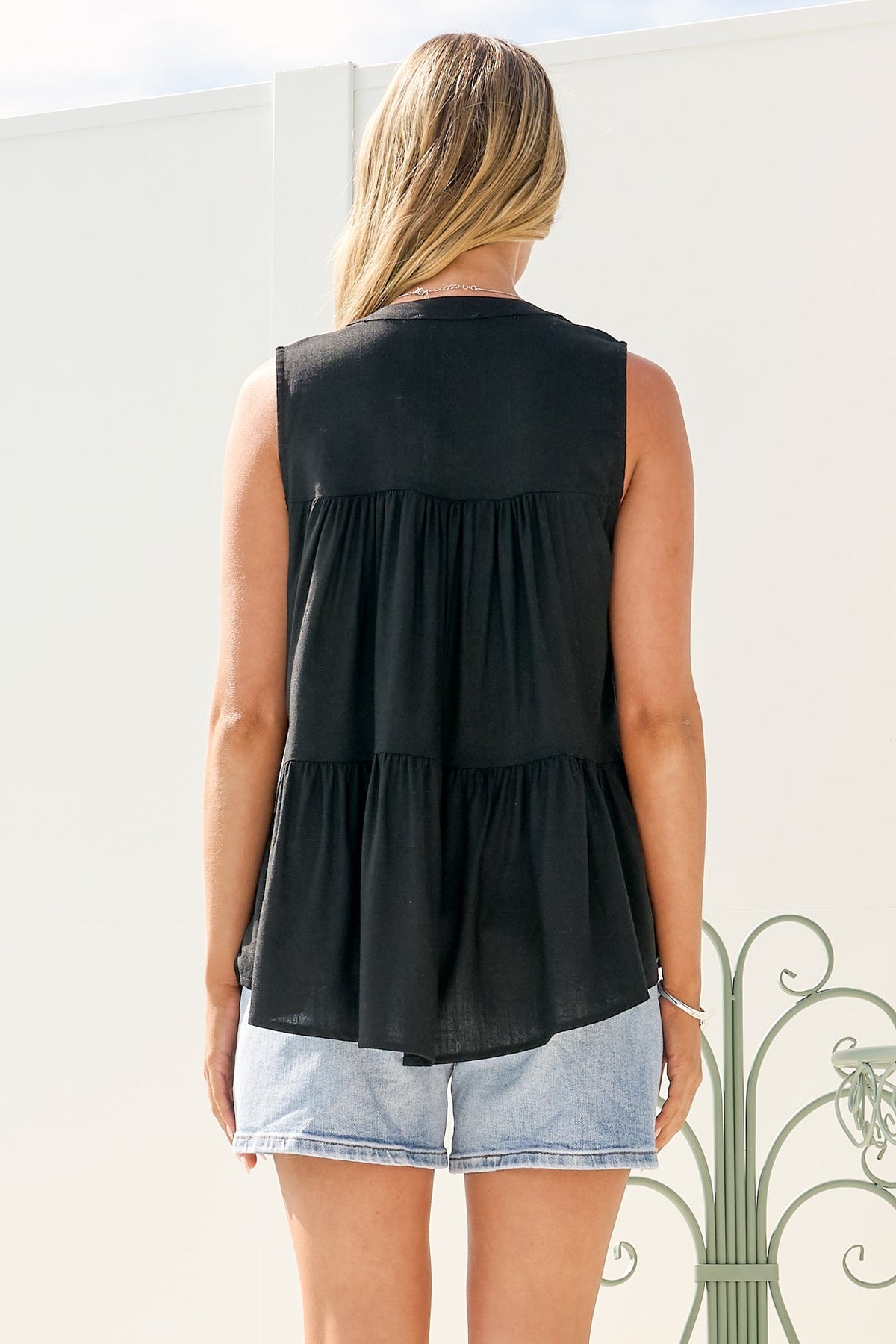 Ariana Top - High Neckline Sleeveless Tiered Button Down in Black